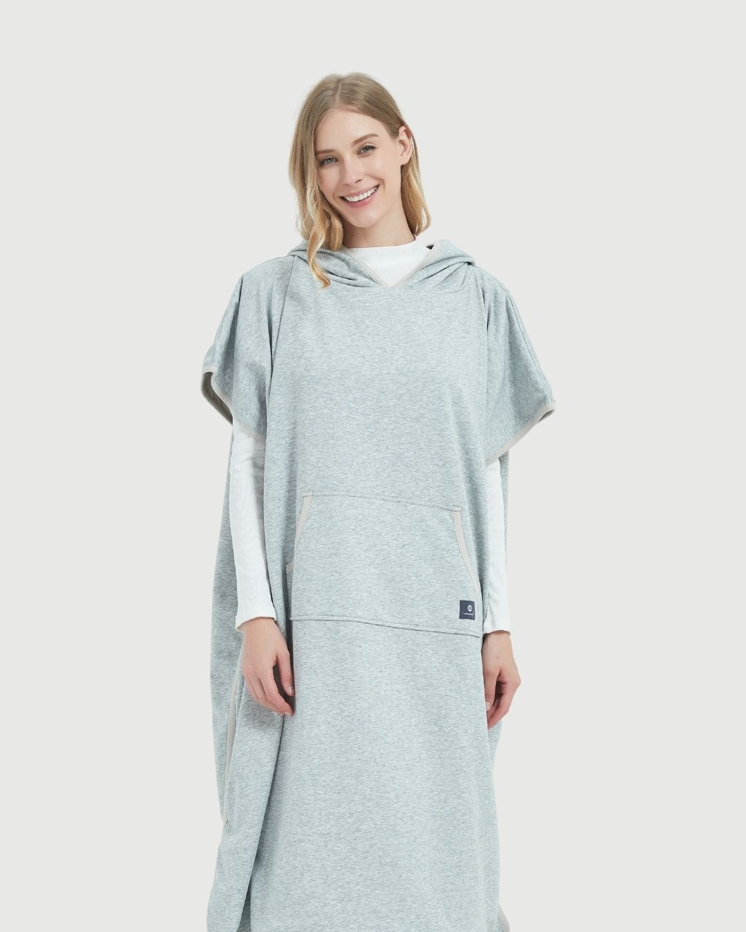 Radia Smart® Adult Hooded Poncho Blanket in Grey offers stylish, full-body comfort with built-in wellness protection. Silver-lined fabric provides advanced shielding against EMF, RF, and 5G radiation, acting as a wearable Faraday cage. Ideal for home, travel, or outdoor use, this hooded poncho combines cozy design with smart technology to help reduce exposure to harmful wireless signals. One-size-fits-most for adults.